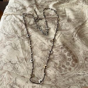Brown chain with interesting silver beads all around.